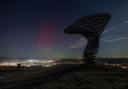 Northern lights over Burnley next to the singing ringing tree