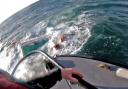 The fishing vessel crew swam to the lifeboat when their boat sank (RNLI Oban HelmetCam/PA)