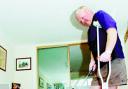 STILL PUTTING: Jim Sawn keeps up the golf while on crutches recovering at home from his broken ankle			  Picture HELEN BROWN