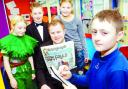 GREAT STORY: Budding reporter Ben Rhodes, 11, takes notes from Telegraph reporter Alex Willmott and pupils (from left) Jessica Tattersall, Dylan Clegg and Holly Rawlinson