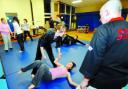 SELF-DEFENCE: Lucy Harper, and Nicole Guest, standing, who applied for the YOF cash, at the Ju-Jitsu class at Newchurch School
