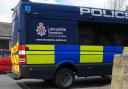 Police dog sniffs out drugs cash and weapons as two arrested during morning raid