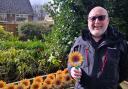HAPPY: Barry Wordsworth with the sunflowers