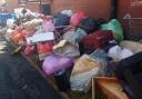 Piles of household rubbish appears overnight on Blackburn street