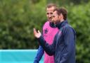 Gareth Southgate shares a word with England captain Harry Kane