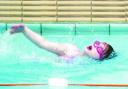 IN THE SWIM: Top, Simone Ellson in the pool