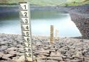 GOING DOWN: Water level markers at Barley reservoir show the dramatic fall in the level, as bosses issue warnings