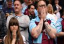 Devastated Burnley fans look on as their side are relegated from the Premier League. Pic: PA