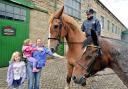 PAST AND PRESENT: Adele Smith, of Rosehill, with children Charlotte and Isobel, meeting Bramley Jack, ridden by Julie Jackson