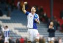 Rovers captain Lewis Travis celebrates at the final whistle