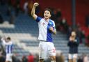 Rovers captain Lewis Travis celebrates at the final whistle
