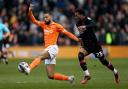 Burnley held at relegation-battlers Blackpool but stretch lead at the top