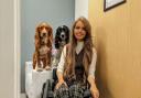 Chloé Fuller with her support dogs, Cinna and Ted