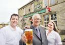 CHEERS From Left, Phil Waters, Tony Wardley and Amanda Waters outside the Four Alls Inn in Higham