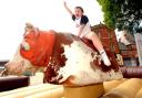 Seven-year-old John Halstead tried his best to hold onto a moving bull in a bucking bronco competition