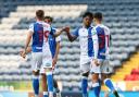 Niall Ennis celebrates after scoring his first Rovers goal