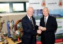 WELL DONE Steve Lee receives long service award from Lancashire FA president Gordon Howard