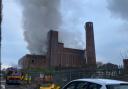 The fire involves a large building containing commercial waste