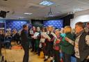 Members of the Blackburn People's Choir perform for Lancashire Sings Christmas in 2022