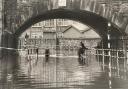 Stubbins Bridge has always been a notorious spot for flooding. Here the water is up to the handlebars of young cyclists pedalling through in September 1968