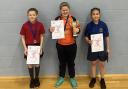 Girls’ top three centre, first place Evelyn from St Paul’s Constablee, left Lola from St James the Less, Rawtenstall and right third place Gianella from Waterfoot Primary School.