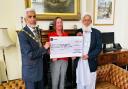 The outgoing Mayor of Blackburn with Darwen has presented £2,000 to the local hospice on behalf of a mosque.