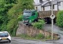 Pictures as lorry blocks road and smashes through railings in Billington