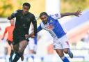 Tyrhys Dolan battles for possession