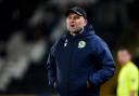 Rovers boss John Eustace looks on