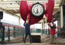 The unveiling of the restored Carnforth Station clock in Lancashire, which has been rehung following repairs