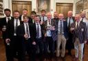 The Old Rossallians team celebrating their victory in the Halford Hewitt trophy room