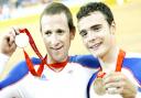 Steven Burke (right) and Bradley Wiggins show off their medals at the 2008 Olympics
