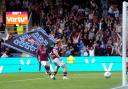 Zian Flemming celebrates scoring Burnley's  second goal of the game to earn a draw