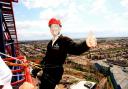 Martin James gives the thumbs-up during his charity abseiling stunt on The Big One