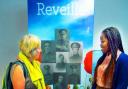 Project volunteer Kasongo Swana and library regular Isabel Butler discuss Reveille