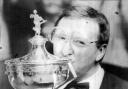 MEMORABLE TRIUMPH: Dennis Taylor kisses the World Championship trophy after beating Steve Davis in 1985