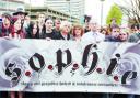 Friends and family of Sophie Lancaster unfurl a banner in her name, calling for an end to hatred and intolerance