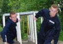 Adam (left) and Nick (right) tackling the assault course. Picture by Dave Sherfield.