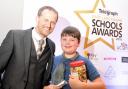 Russell Dawson presents the Primary School Pupil of the Year Award to Owen Sharples.