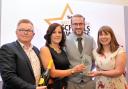 Paul Hibbs (left) presents the award to Laura Miller, Paul Burns and Tina Wilkinson of St Andrew's CE Primary School, Oswaldtwistle.