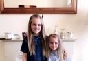 Tienna Cooper, nine, and her sister Ziani, six
