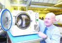 PROUD: Ian Starkey, managing director of Prestige Medical, with a C3 Advance Autoclave