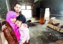 SAFE: Coun Arshid Mahmood with his wife and young daughter who escaped the blaze