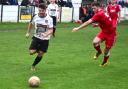 Action from Bacup Borough's (white) defeat to Longridge Town at the weekend