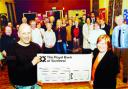 GIFT: Stubbins Residents' Association chairman Simon Gillibrand gives the cheque to Age Concern's Marion Haworth