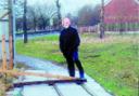 OBSTACLE: Neil Linaker, 74, fell trying to get past iron sheets that are blocking the pathway on Queen's Park Road