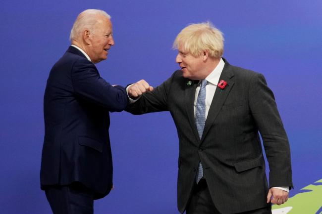 Boris Johnson greets US President Joe Biden as they arrive at the COP26 summit in Glasgow