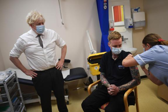 Lancashire Telegraph: Boris Johnson watches on as Covid vaccine is administered. (PA) Lancashire Telegraph: Boris Johnson watches on as Covid vaccine is administered. (PA)