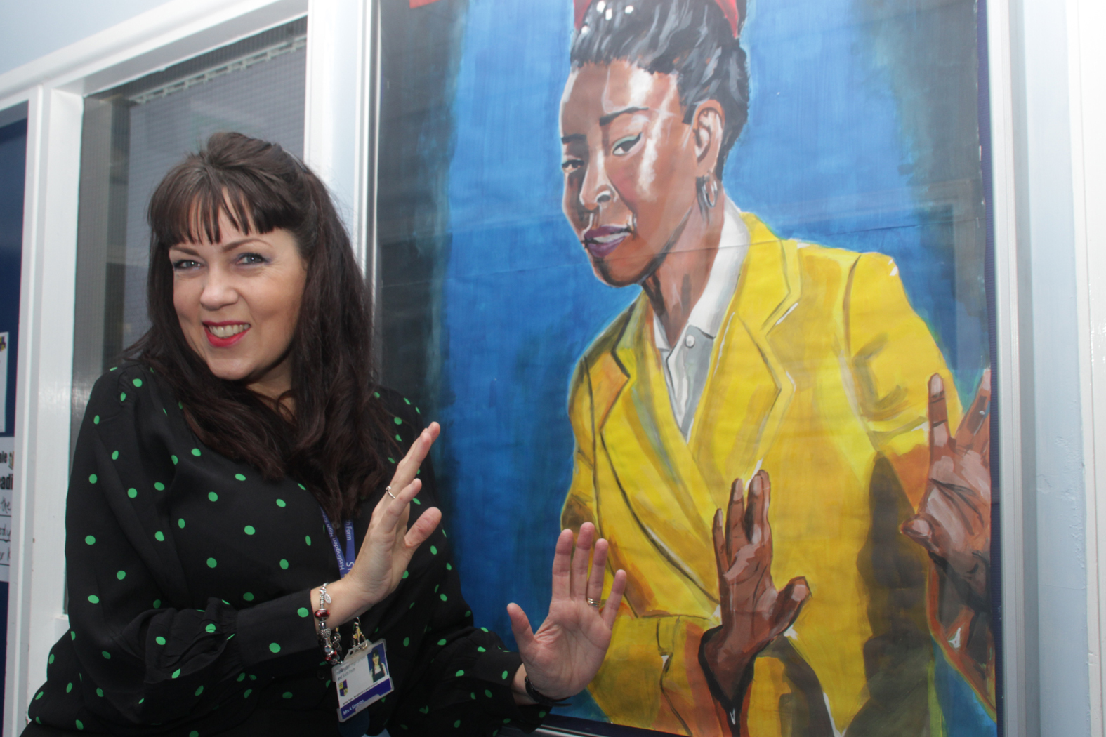 PAINTING: Andrea Simpson with her portrait of Amanda Gorman 