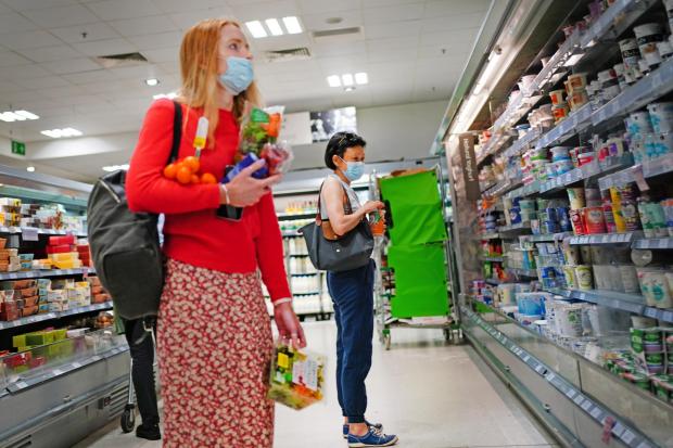 Lancashire Telegraph: Shoppers in a supermarket (PA)